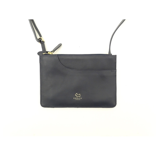 1402 - Vintage fashion / clothing: A Radley navy leather Pocket crossbody bag. Approx. 8 1/2