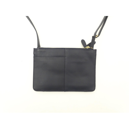 1402 - Vintage fashion / clothing: A Radley navy leather Pocket crossbody bag. Approx. 8 1/2