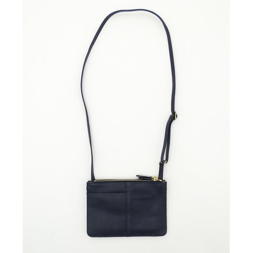 1402 - Vintage fashion / clothing: A Radley navy leather Pocket crossbody bag. Approx. 8 1/2