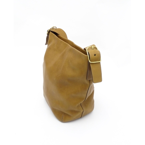 1405 - Vintage fashion / clothing: A Coach tan leather vintage legacy shoulder bag with monogram lining. Co... 