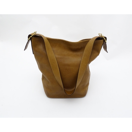 1405 - Vintage fashion / clothing: A Coach tan leather vintage legacy shoulder bag with monogram lining. Co... 