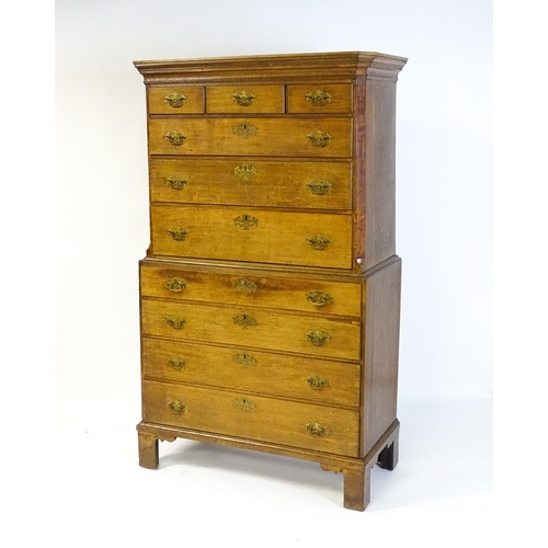 1566 - A late 18thC / early 19thC oak chest on chest with a moulded cornice above three short over seven lo... 