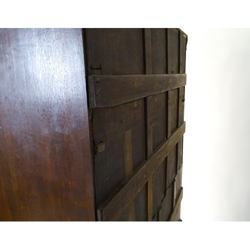 1566 - A late 18thC / early 19thC oak chest on chest with a moulded cornice above three short over seven lo... 