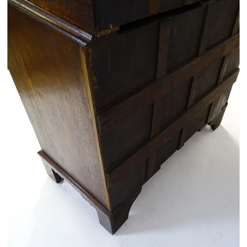 1566 - A late 18thC / early 19thC oak chest on chest with a moulded cornice above three short over seven lo... 