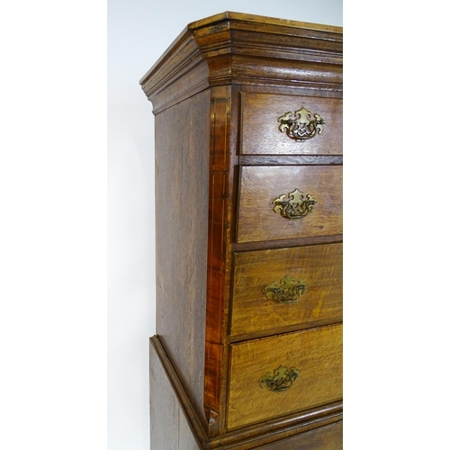 1566 - A late 18thC / early 19thC oak chest on chest with a moulded cornice above three short over seven lo... 