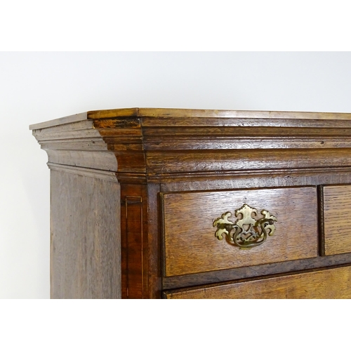 1566 - A late 18thC / early 19thC oak chest on chest with a moulded cornice above three short over seven lo... 