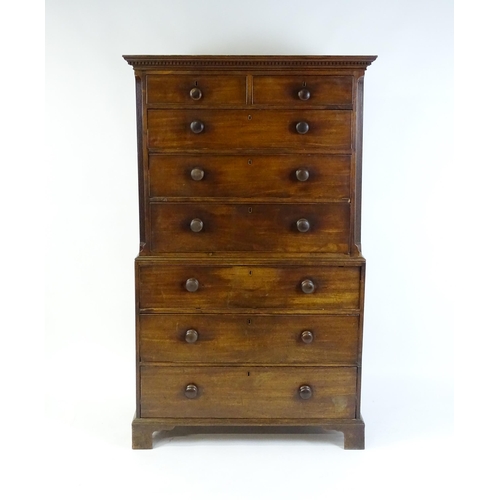 1586 - A late 18thC mahogany chest on chest with a moulded cornice above two short over six long graduated ... 