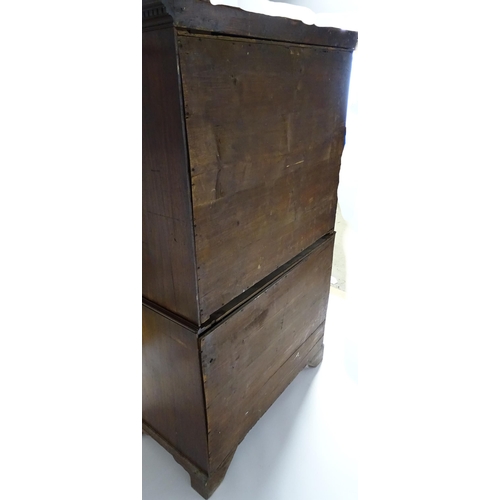 1586 - A late 18thC mahogany chest on chest with a moulded cornice above two short over six long graduated ... 