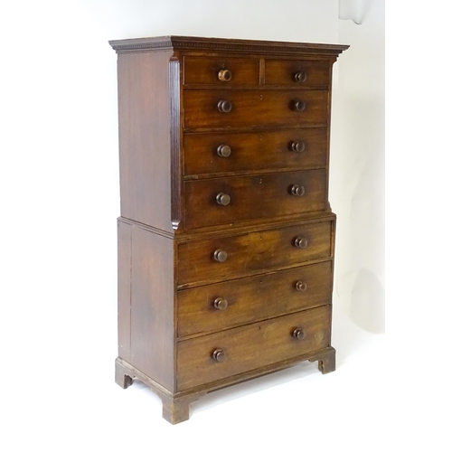 1586 - A late 18thC mahogany chest on chest with a moulded cornice above two short over six long graduated ... 