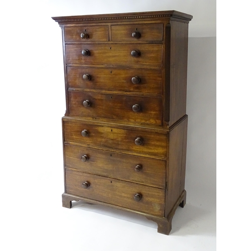 1586 - A late 18thC mahogany chest on chest with a moulded cornice above two short over six long graduated ... 