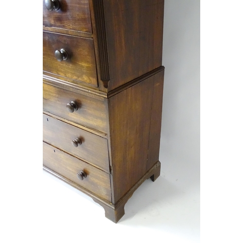 1586 - A late 18thC mahogany chest on chest with a moulded cornice above two short over six long graduated ... 