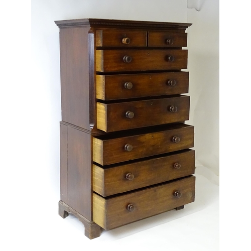 1586 - A late 18thC mahogany chest on chest with a moulded cornice above two short over six long graduated ... 