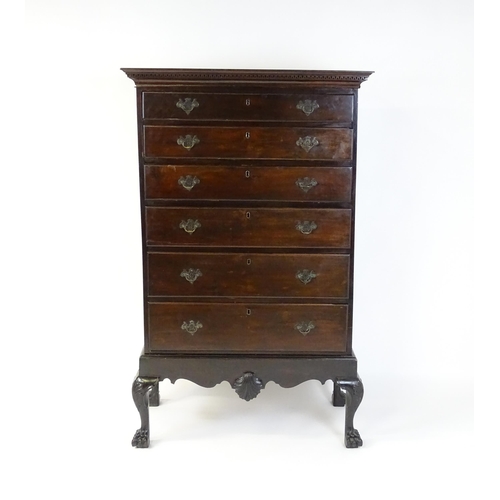 1587 - An 18thC and later mahogany chest on stand with a Greek Key moulded cornice above six graduated draw... 