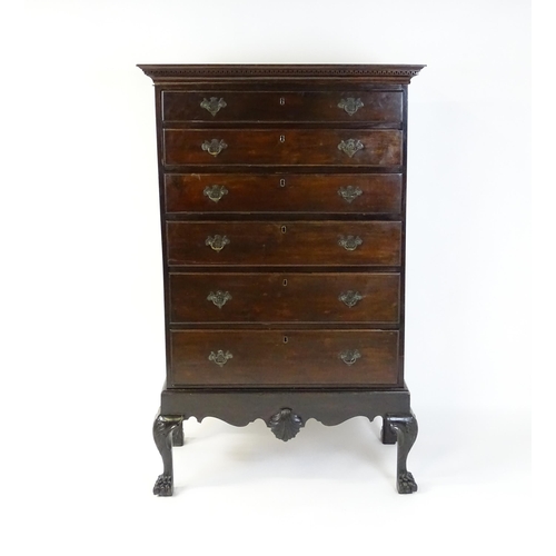 1587 - An 18thC and later mahogany chest on stand with a Greek Key moulded cornice above six graduated draw... 