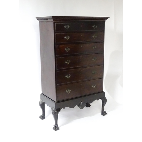 1587 - An 18thC and later mahogany chest on stand with a Greek Key moulded cornice above six graduated draw... 