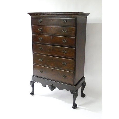 1587 - An 18thC and later mahogany chest on stand with a Greek Key moulded cornice above six graduated draw... 