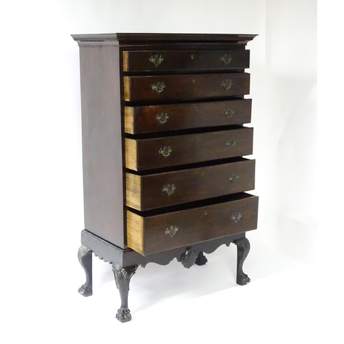 1587 - An 18thC and later mahogany chest on stand with a Greek Key moulded cornice above six graduated draw... 