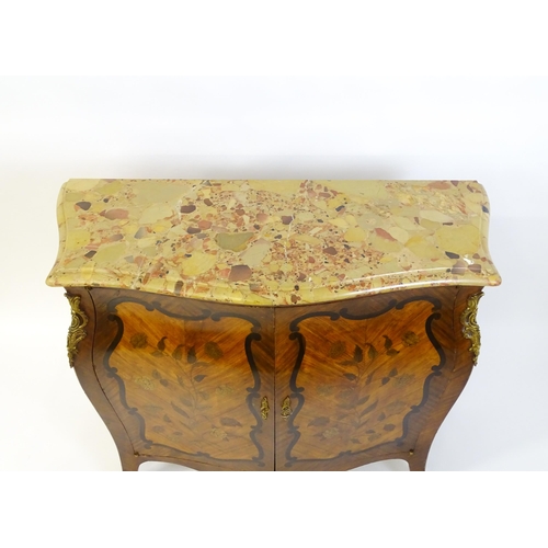 1590 - A late 19thC marble topped commode with brass mounts and two marquetry inlaid doors raised on four t... 