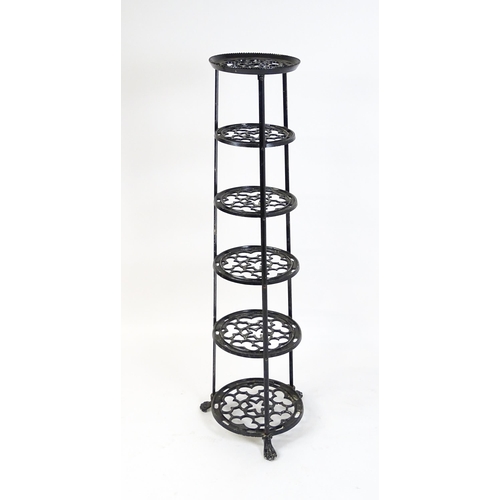 1624 - A 20thC six tier graduated pot stand with pierced decoration. 48