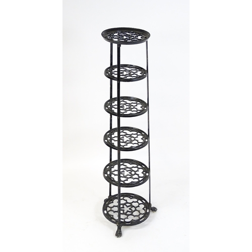 1624 - A 20thC six tier graduated pot stand with pierced decoration. 48