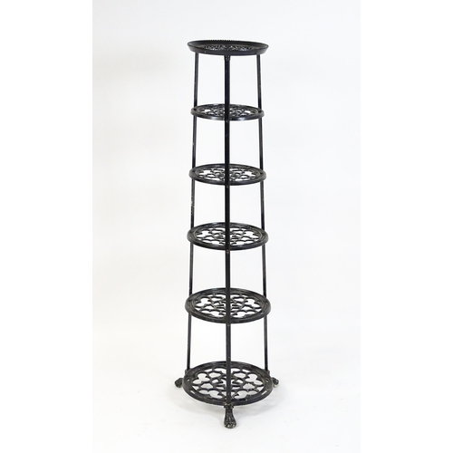 1624 - A 20thC six tier graduated pot stand with pierced decoration. 48