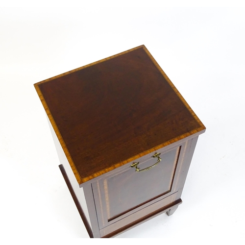 1666 - An Edwardian mahogany perdonium with a satinwood crossbanded top and front panel raised on four tape... 