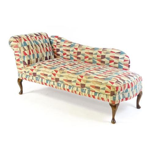 1694 - A mid 20thC chaise longue with a scrolled end and shaped backrest raised on four cabriole legs termi... 