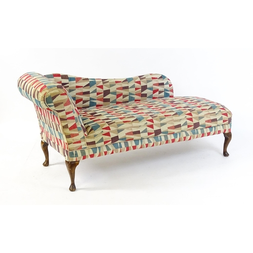 1694 - A mid 20thC chaise longue with a scrolled end and shaped backrest raised on four cabriole legs termi... 