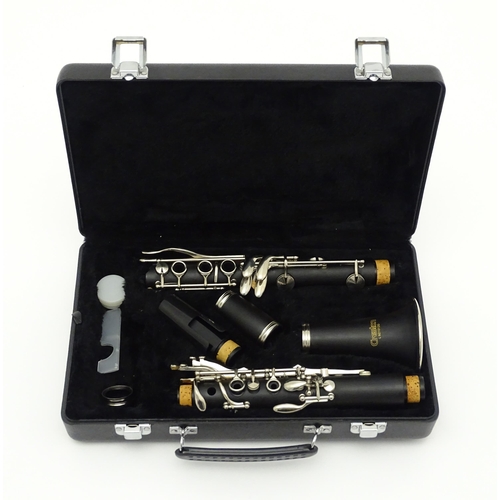 1367 - Musical Instrument: sections and parts of a Creston clarinet, serial number L9210120. In fitted hard... 