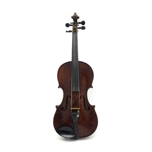 1373 - Musical Instrument: a cased early 20thC continental violin and bow, the interior bearing label 'Carl... 