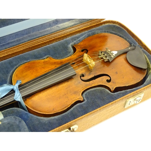 1376 - Musical Instrument: an early 19thC violin, the interior bearing labels 'Repaired by H. Pickard 137 K... 