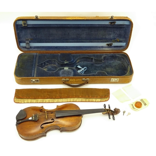 1376 - Musical Instrument: an early 19thC violin, the interior bearing labels 'Repaired by H. Pickard 137 K... 