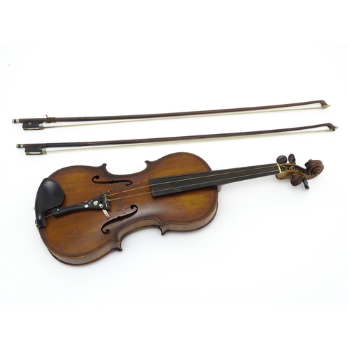 1377 - Musical Instrument: an early 20thC continental violin, constructed from maple with mahogany tuning p... 