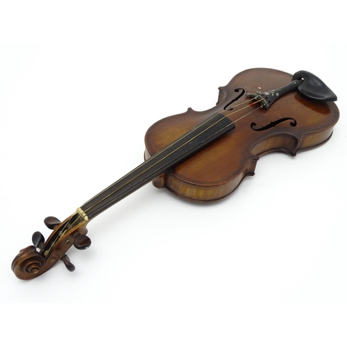 1377 - Musical Instrument: an early 20thC continental violin, constructed from maple with mahogany tuning p... 