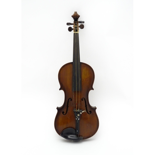 1377 - Musical Instrument: an early 20thC continental violin, constructed from maple with mahogany tuning p... 