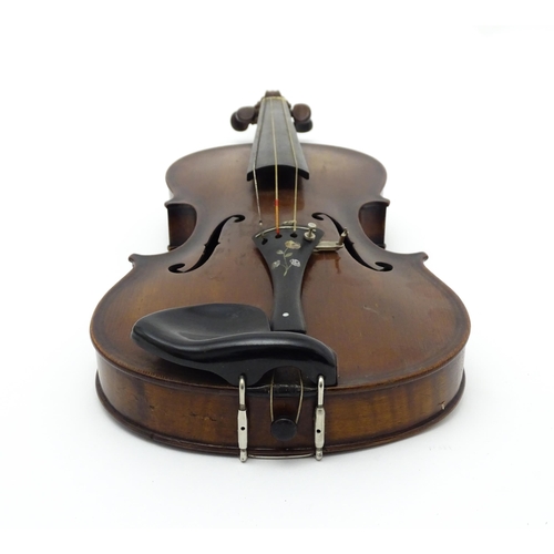 1377 - Musical Instrument: an early 20thC continental violin, constructed from maple with mahogany tuning p... 