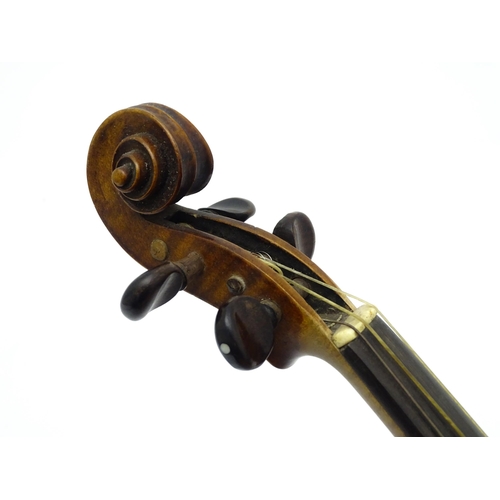 1377 - Musical Instrument: an early 20thC continental violin, constructed from maple with mahogany tuning p... 