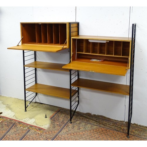 1752 - A mid-20thC Staples Ladderax modular shelving system, comprising two drop-front cabinets with sectio... 