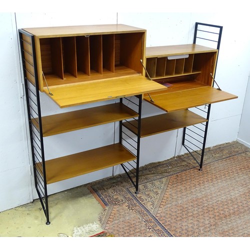 1752 - A mid-20thC Staples Ladderax modular shelving system, comprising two drop-front cabinets with sectio... 