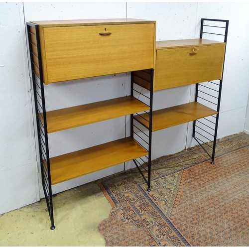 1752 - A mid-20thC Staples Ladderax modular shelving system, comprising two drop-front cabinets with sectio... 