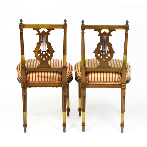 1696 - A pair of early 20thC lyre back side chairs with upholstered seats, on fluted legs. Approx. 32 1/2” ... 