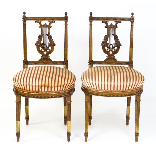 1696 - A pair of early 20thC lyre back side chairs with upholstered seats, on fluted legs. Approx. 32 1/2” ... 