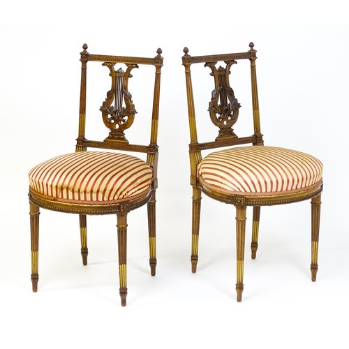 1696 - A pair of early 20thC lyre back side chairs with upholstered seats, on fluted legs. Approx. 32 1/2” ... 