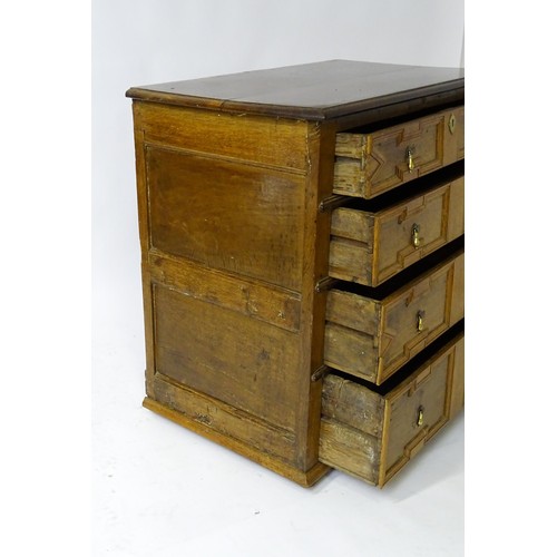 1697 - A late 17thC oak chest of drawers with a rectangular top above four graduated drawers with geometric... 