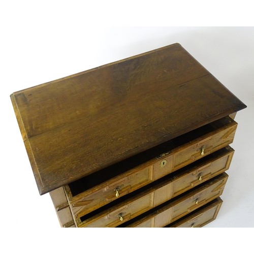 1697 - A late 17thC oak chest of drawers with a rectangular top above four graduated drawers with geometric... 