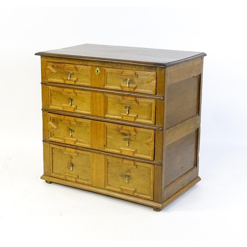 1697 - A late 17thC oak chest of drawers with a rectangular top above four graduated drawers with geometric... 