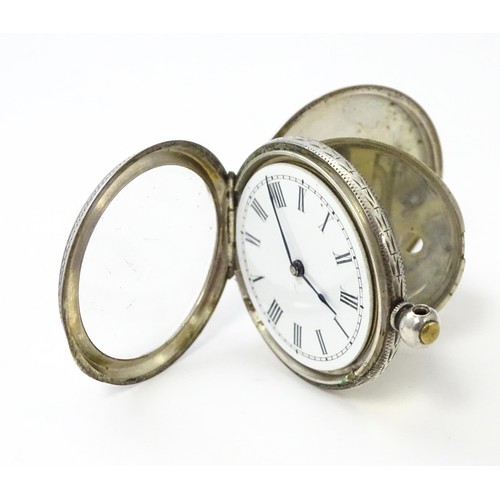 760 - A white metal cased fob watch, the white enamel dial having Roman numerals. Together with a watch ke... 