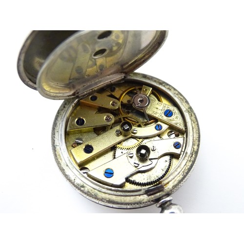 760 - A white metal cased fob watch, the white enamel dial having Roman numerals. Together with a watch ke... 