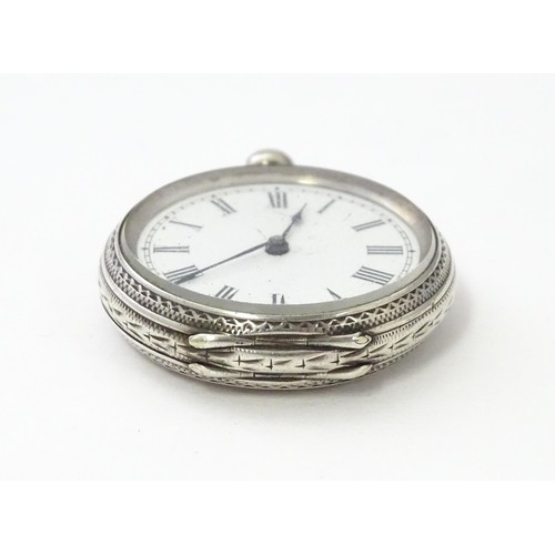 760 - A white metal cased fob watch, the white enamel dial having Roman numerals. Together with a watch ke... 