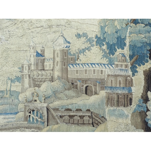 1383 - A late 17th / early 18thC Brussels tapestry depicting a pastoral tree lined landscape with castle by... 